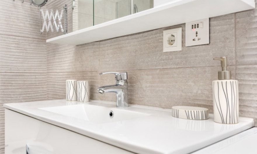 A beautiful new bathroom sink and backsplash. Home remodeling can range from replacing  fixtures to reworking your floor plan.